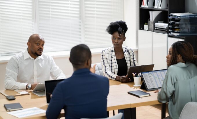 African Group Corporate Business Meeting Group discussing in a corporate setting.