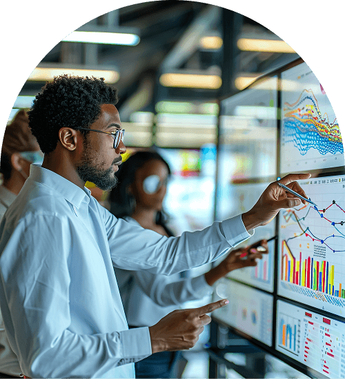 Person analyzing data on screens.